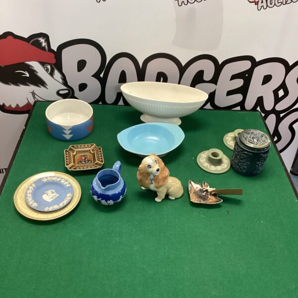 Vintage Wedgwood porcelain collection featuring a creamer, bowl, and plate.