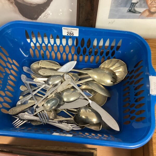 Vintage silverplate cutlery tray with mixed forks, knives, and spoons.