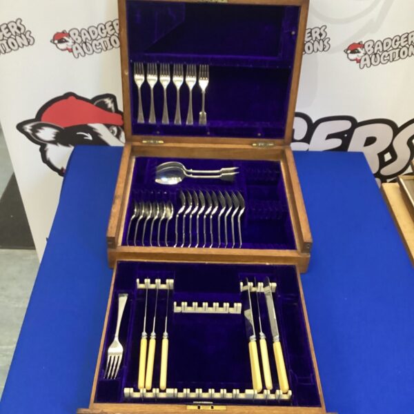 Open Kendal Milne cutlery canteen displaying silver plate set.