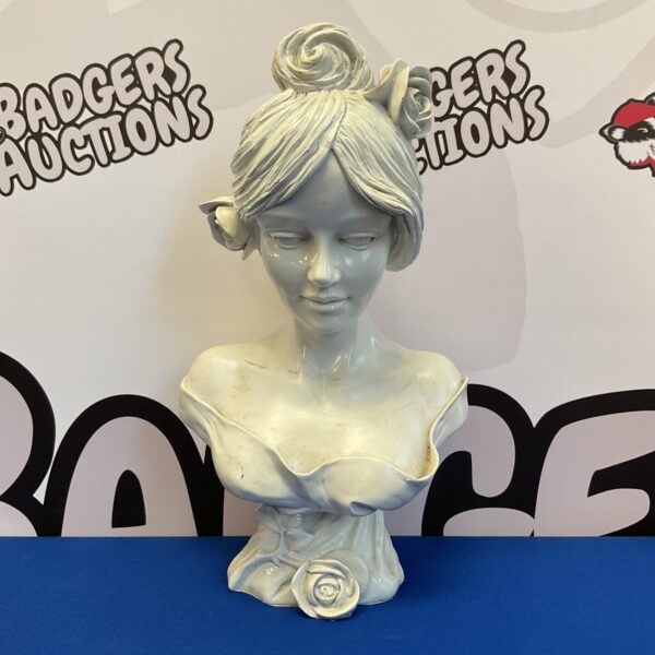 Vintage ceramic lady bust with flowers in hair, elegant sculpture.