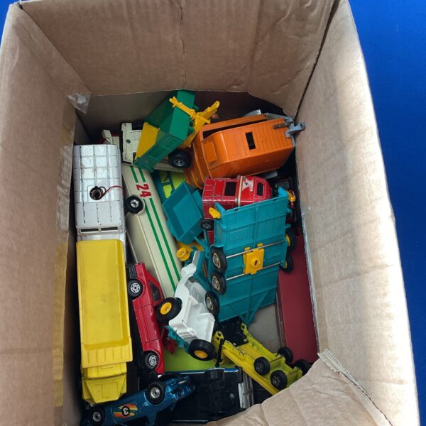 Vintage diecast toy vehicles lot including trucks and cars.