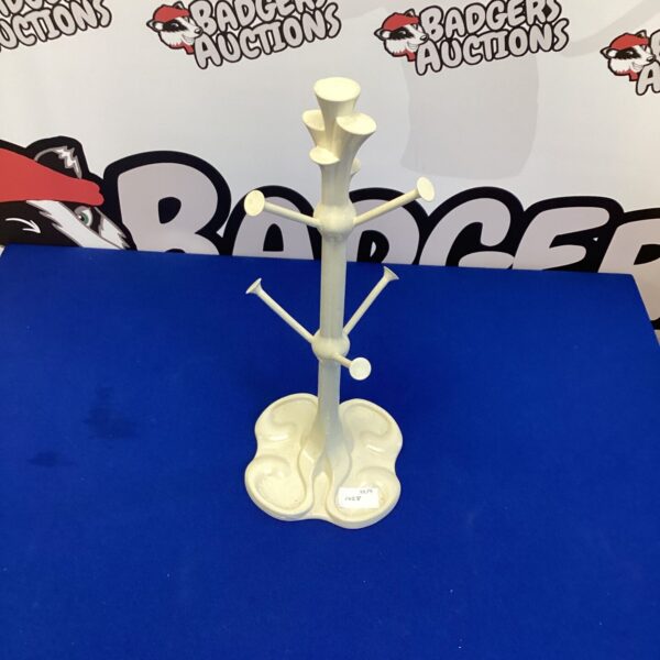 Vintage wrought iron cup stand with Bexismon mark.