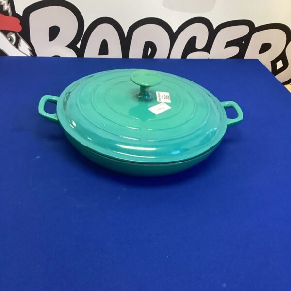 Vibrant turquoise cast iron casserole dish for cooking and serving.