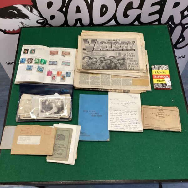 WWII ephemera lot including newspapers, letters and registration cards.