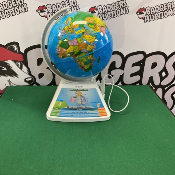 Vintage Oregon Scientific globe on a desktop, educational geography toy.