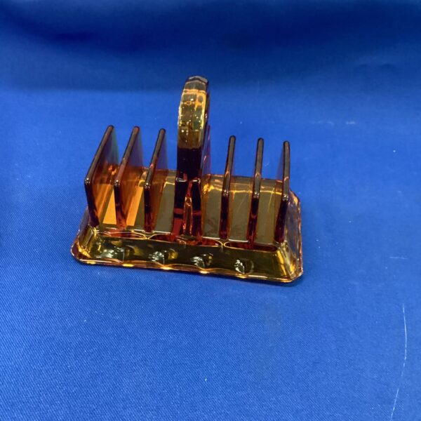 Vintage amber glass toast rack for serving breakfast.