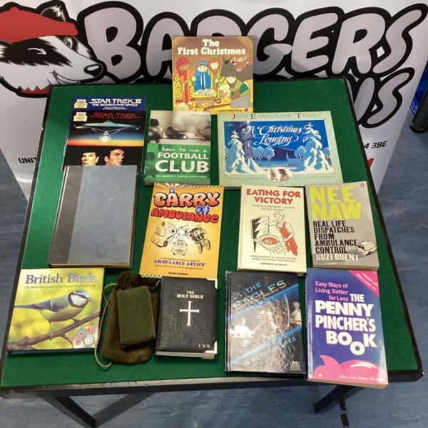Vintage mixed book lot including "Eating for Victory" and sports guides.
