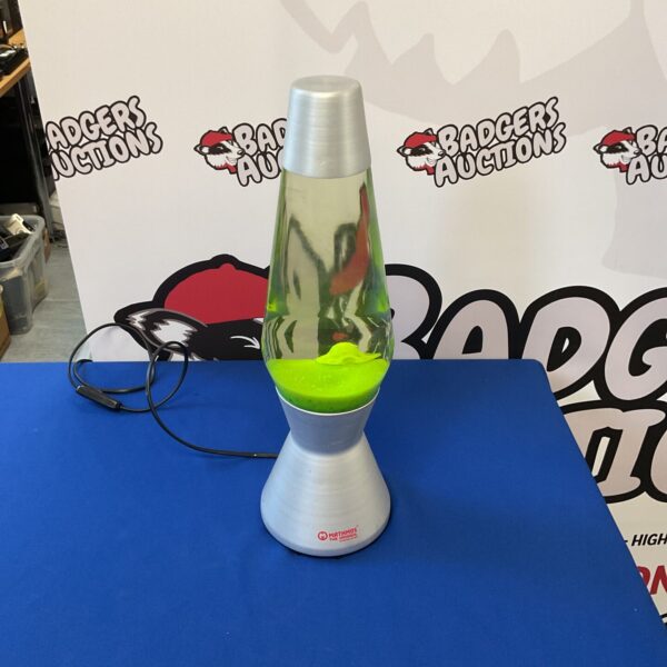 Vintage Mathmos lava lamp with green lava motion.