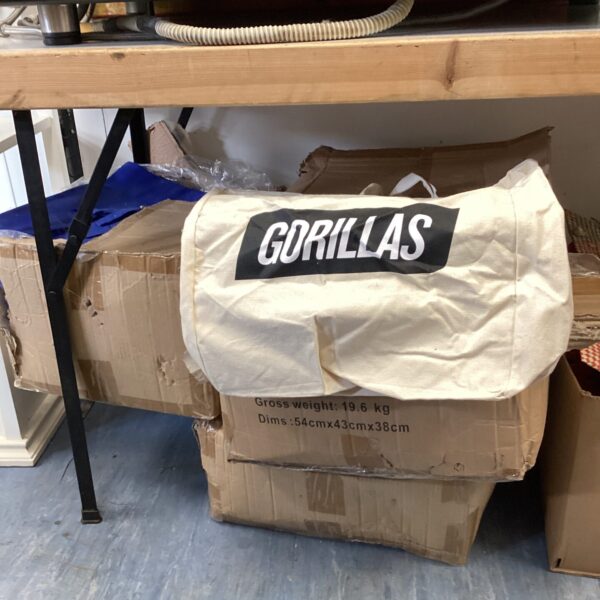 Mixed lot of shopping bags in cardboard boxes.