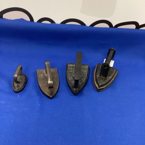 Lot of four antique French flat irons in cast iron.