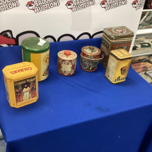 Selection of vintage tins, colourful advertising designs, antique kitchenalia.