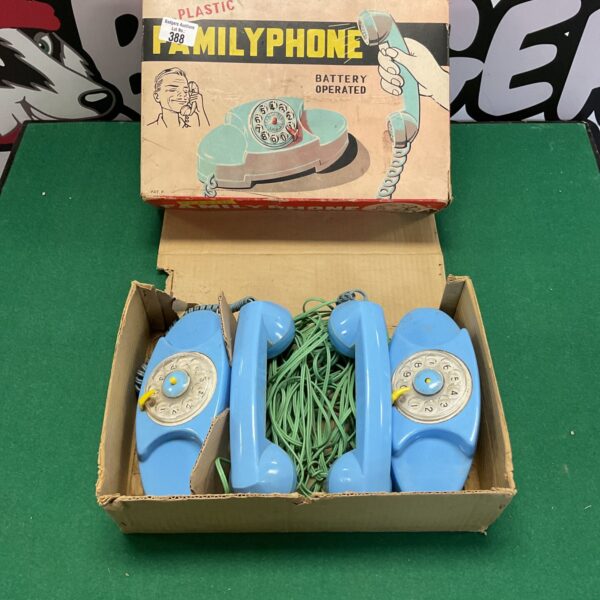 Brightly coloured vintage family phone, model 388, rotary dial.