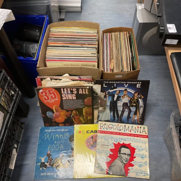Vintage vinyl record collection lot with diverse album covers.
