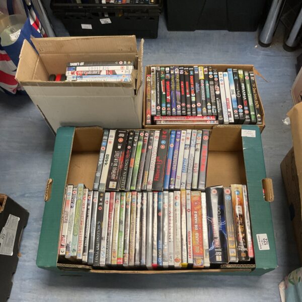 Assorted DVD movie lot in three cardboard boxes, ready for collection.