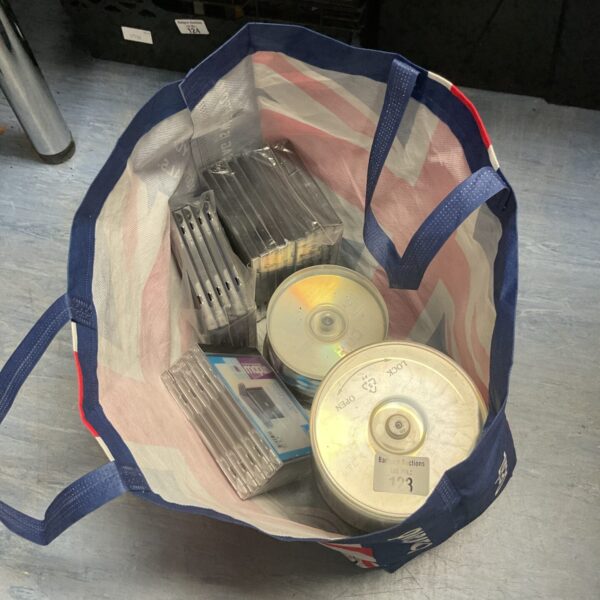 Lot of blank DVDs and CDs for data storage.
