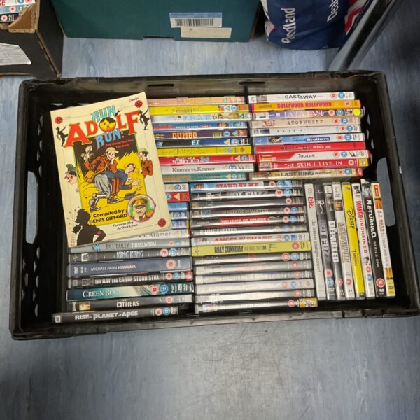 Tray of DVDs & run Adolfo run corgi book by Denis gifford