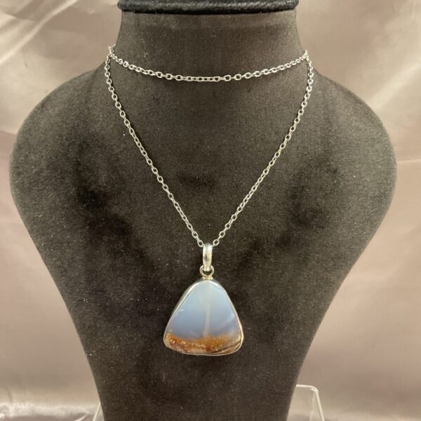Silver pendant necklace with a colourful opal gemstone.