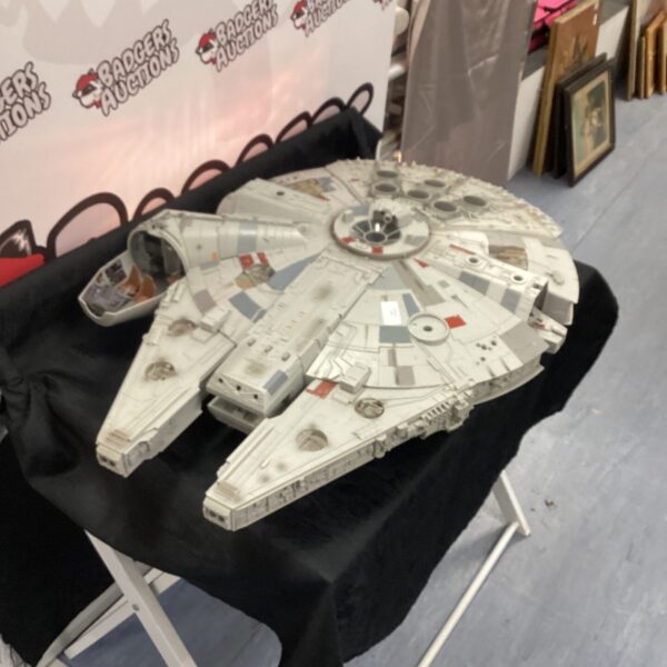 Vintage Star Wars Millennium Falcon toy, detailed spaceship collectible.