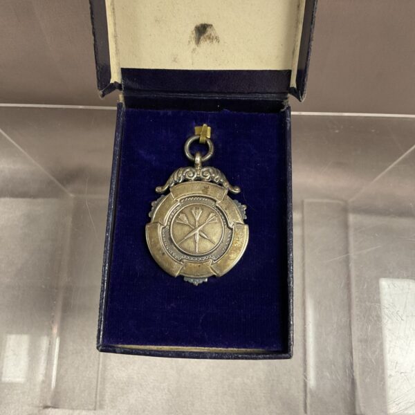 Vintage sterling silver darts medal in presentation case.