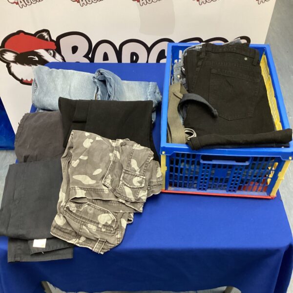 Crate full of new size 34 jeans for sale.