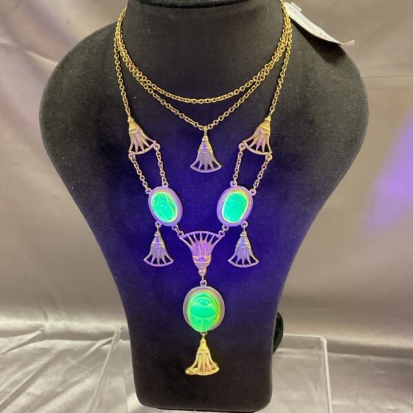 Christian Dior Egyptian Revival necklace with lucite scarabs on mannequin.