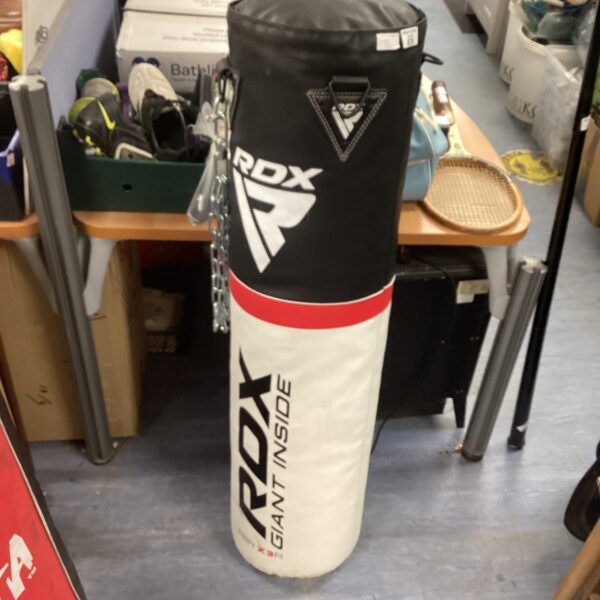 Front view of a used RDX punch bag for boxing training.