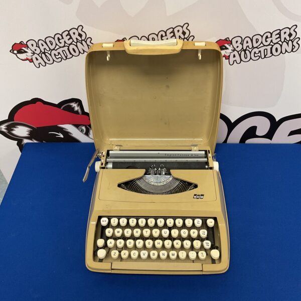 Vintage Empire Corona DeLuxe typewriter in black and chrome.