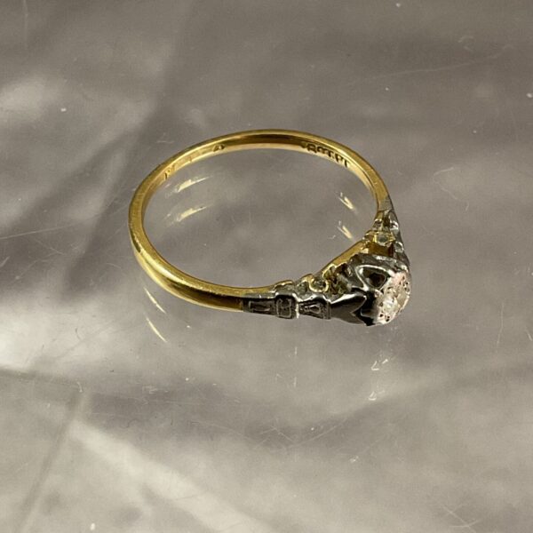 Close-up of an 18ct gold and platinum diamond ring.
