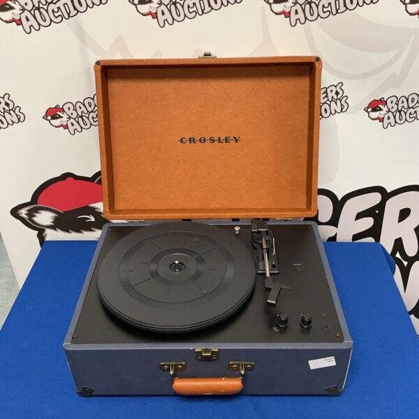 Vintage Crosley record player in woodgrain finish.