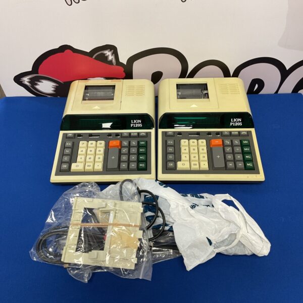 Two vintage Lion P1205 calculators in used condition.