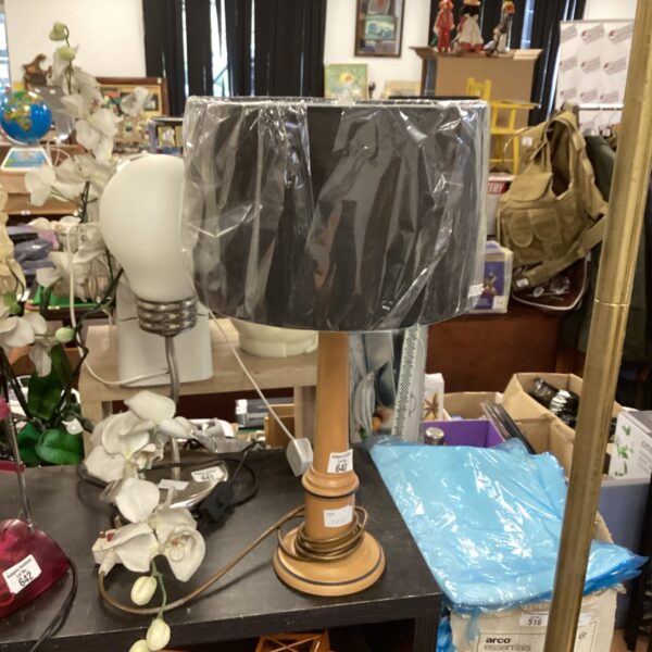 Vintage wooden table lamp with fabric shade, retro style.
