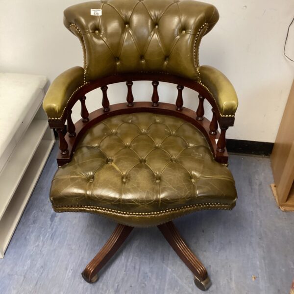 Vintage green leather captains chair with swivel base.