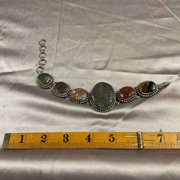 Vintage agate bracelet with six polished stones.