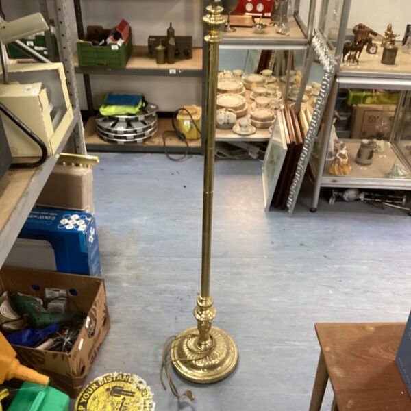 Vintage brass standard lamp needing restoration for a classic look.