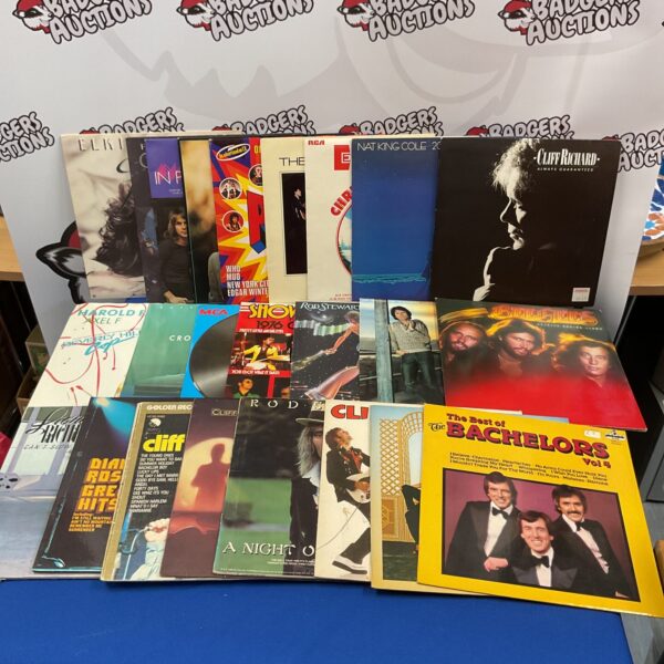 Vintage vinyl record collection featuring Bee Gees and Rod Stewart.