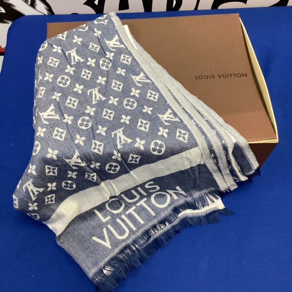Louis Vuitton style shawl with repeating monogram pattern.