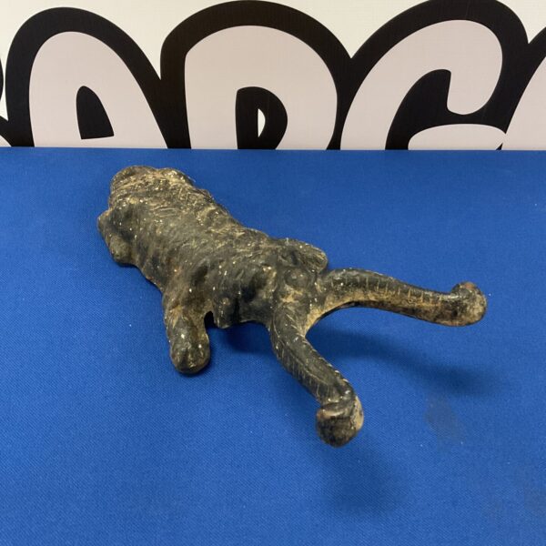 Vintage cast iron dog boot scraper for cleaning footwear.