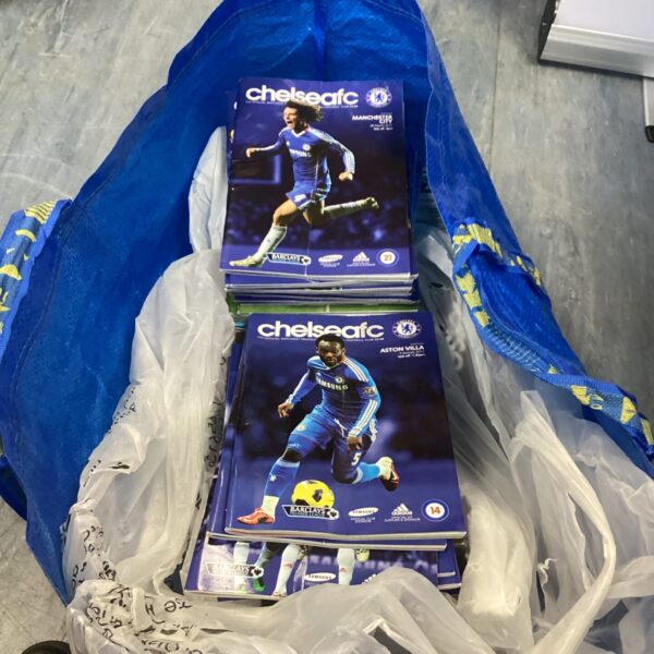 Large lot of vintage Chelsea FC match programs for collectors.