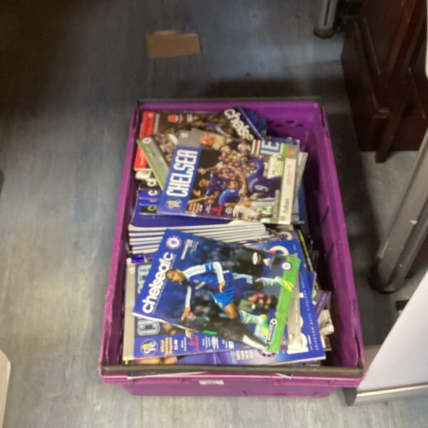 Collection of vintage Chelsea FC football programs for collectors.