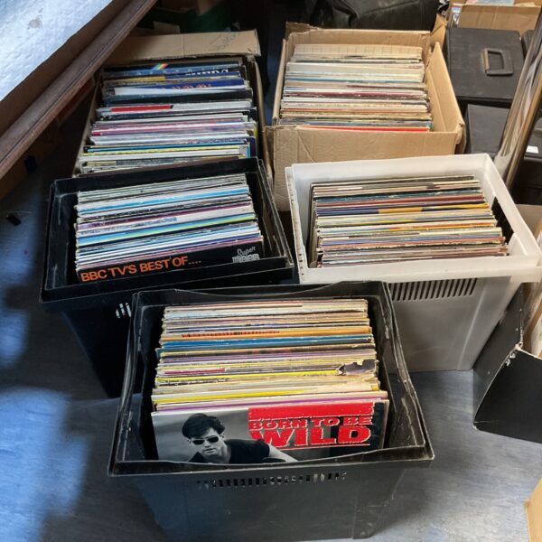 Large collection of vinyl records in boxes, ready for auction.