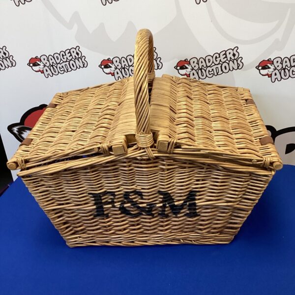 Woven wicker Fortnum and Mason style picnic basket with handle.