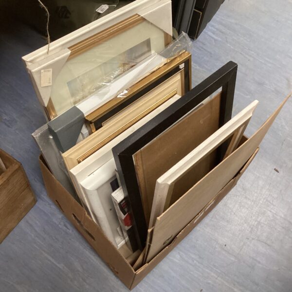 Mixed lot of various sized picture frames for art display.