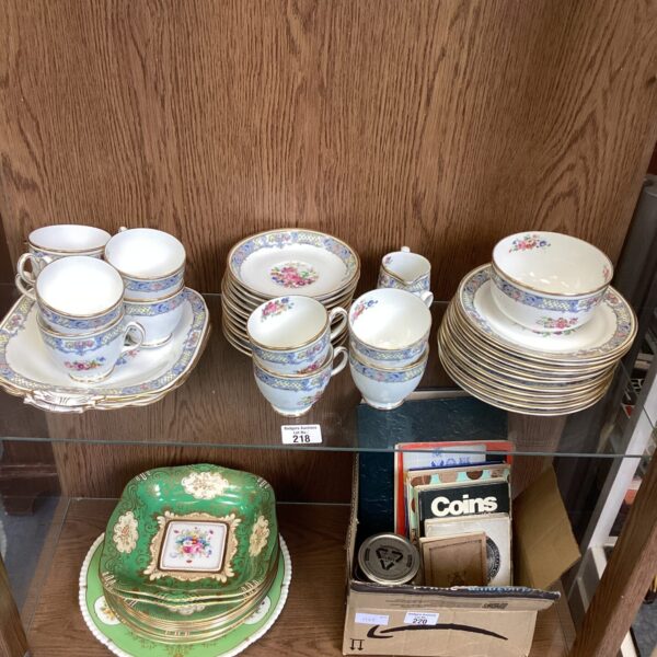 Vintage Grosvenor China tea set with floral design on display.