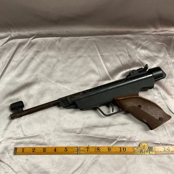 Vintage Diana .177 air pistol with wooden grip and blued finish.
