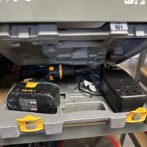 Ryobi cordless drill with battery and charger for DIY projects.