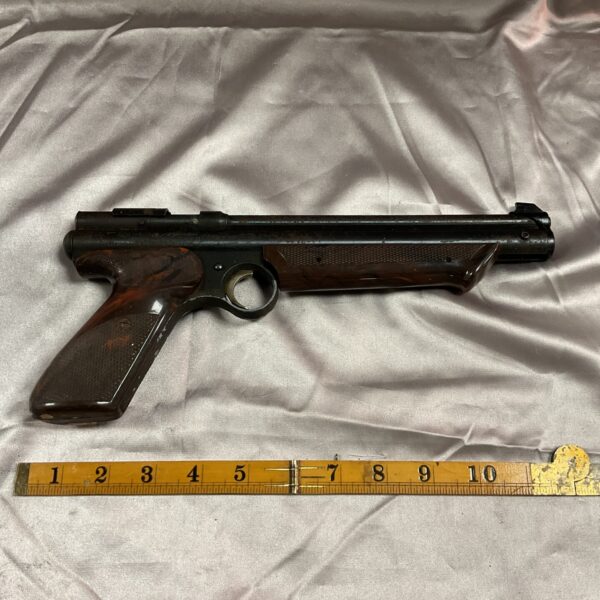 Vintage Crossman Medallist 2 model 1300 .22 pistol with wooden grip.
