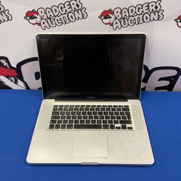 Silver Apple MacBook Pro laptop for spares or repair.