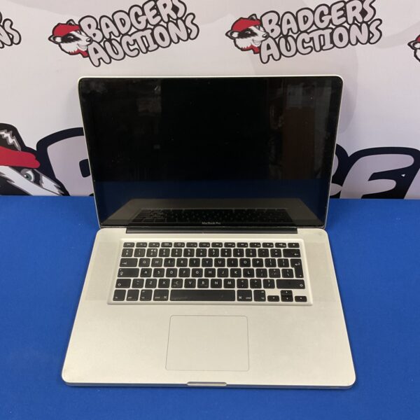 Used Apple MacBook Pro laptop in silver, showing wear.
