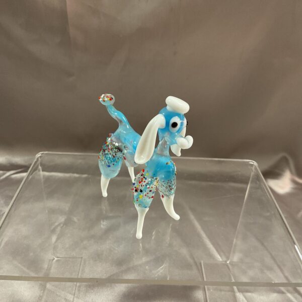 Vibrant Murano glass poodle sculpture with speckled details.