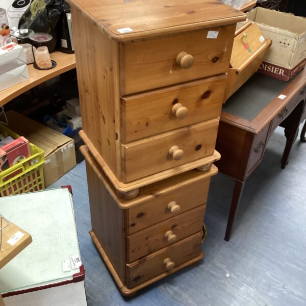 Stacked pine bedside cabinets offering bedroom storage.